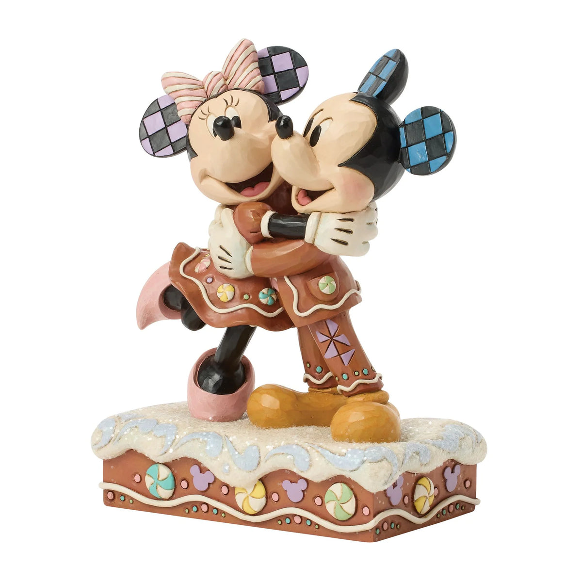 Topolino e Minnie visti di tre quarti da sinistra: pantaloni di pan di zenzero di Topolino con decori lilla a girandola e gonna con caramelle di Minnie