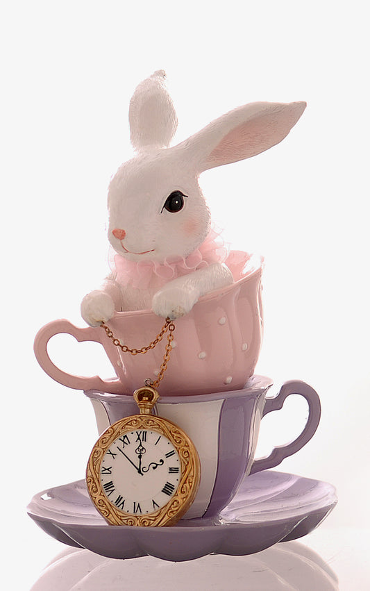 coniglio dentro tazze da tè con orologio