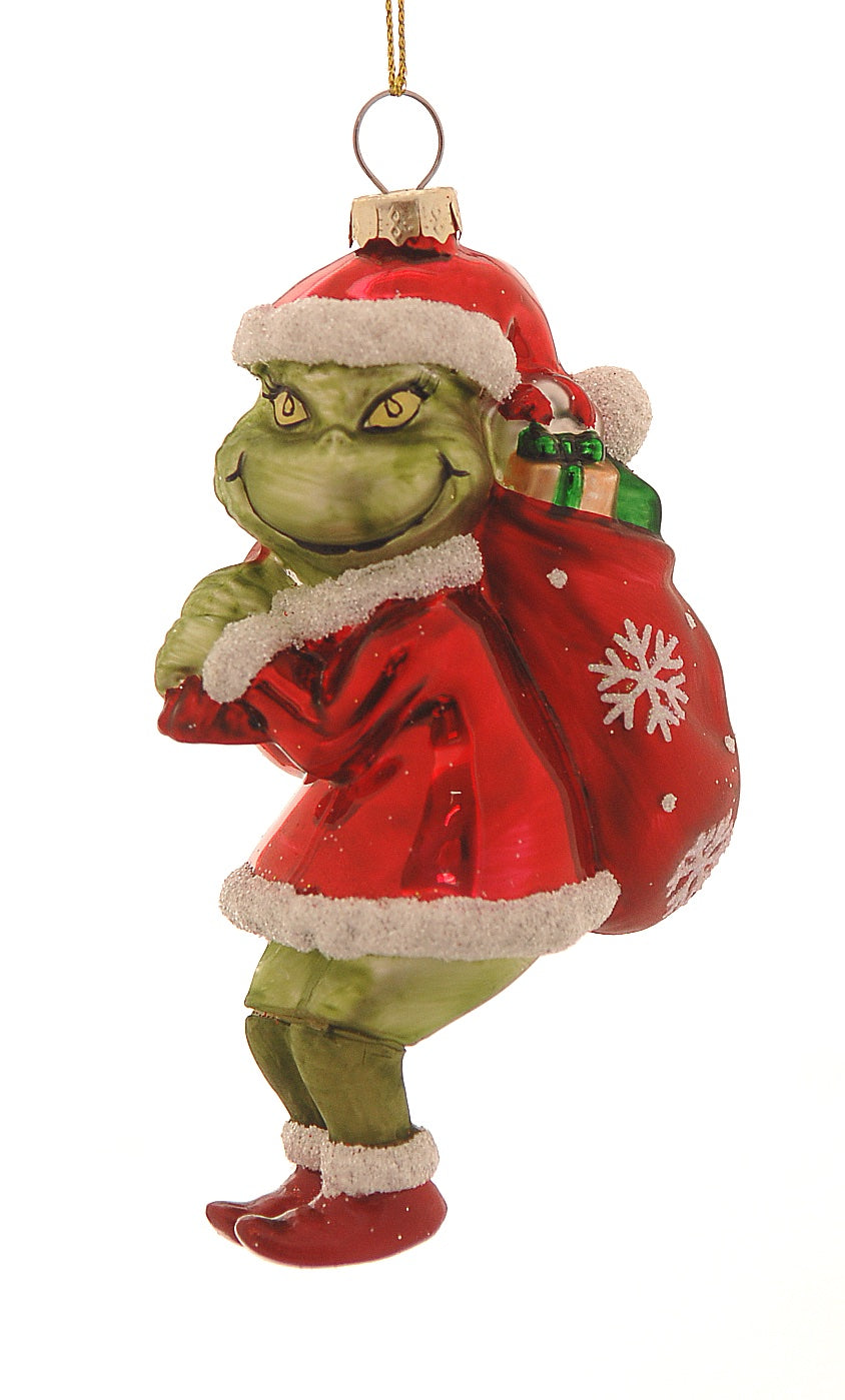 Addobbo natalizio in vetro a forma di Grinch vestito da Babbo Natale, con cappello rosso e sacco di regali con fiocchi di neve