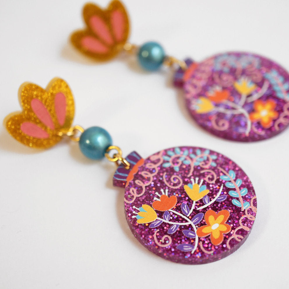 orecchini tondi con fiori glitter