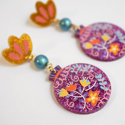 orecchini tondi con fiori glitter
